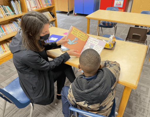 Volunteer and Student reading