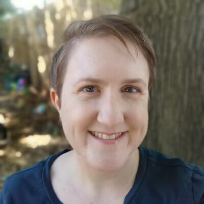 A close headshot of Alison, a woman with short hair and in a dark blue t-shirt.